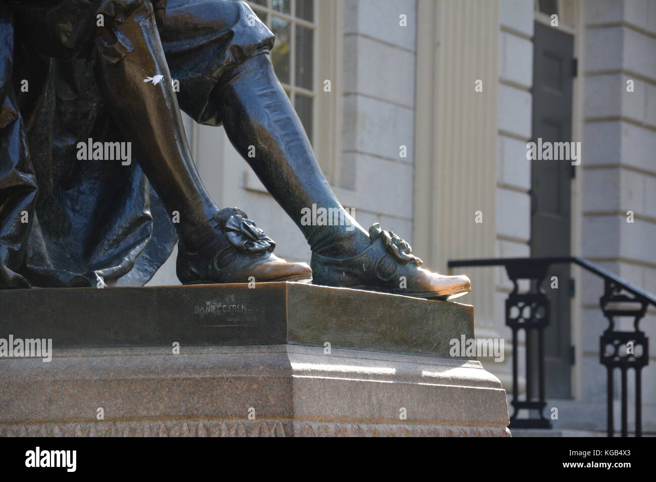 The famous John Harvard statue in Harvard Yard at Harvard University in