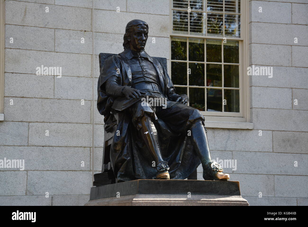 The famous John Harvard statue in Harvard Yard at Harvard University in