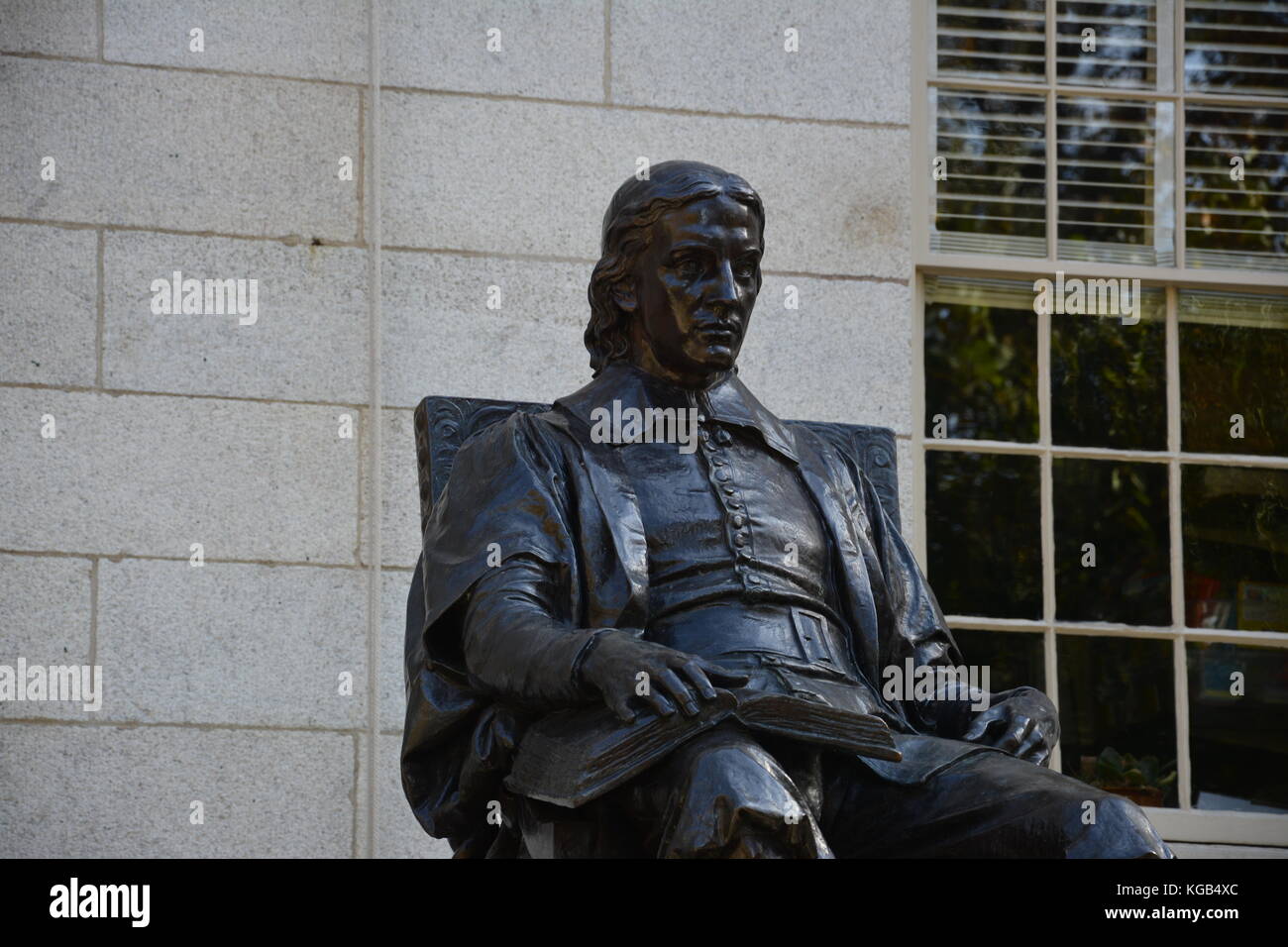 The famous John Harvard statue in Harvard Yard at Harvard University in
