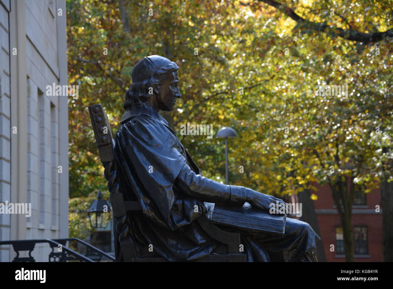 The famous John Harvard statue in Harvard Yard at Harvard University in