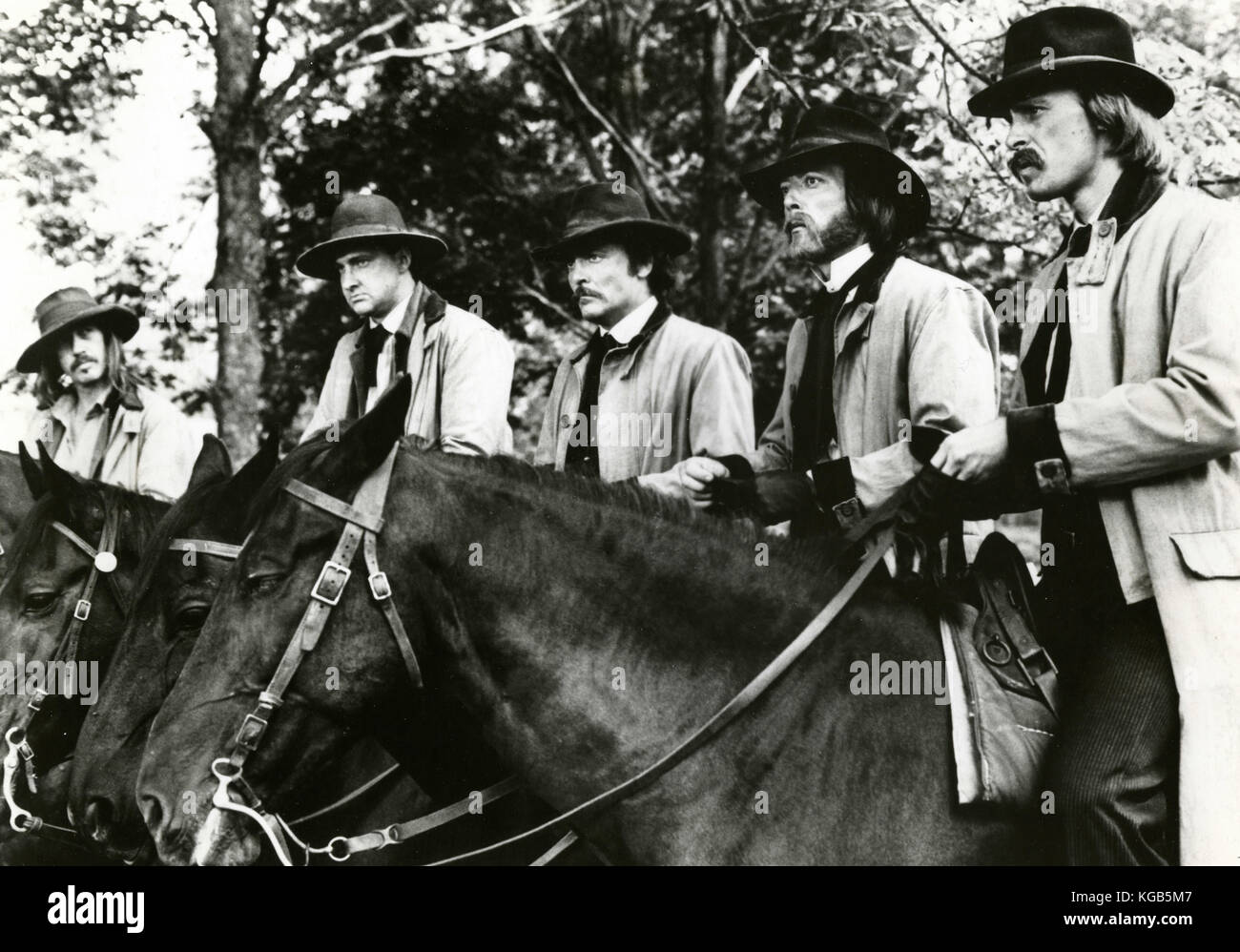 Actors Stacy Keach, James Keach, Randy Quaid, Dannis Quaid, and Keith Carradine in the movie The Long Riders, 1980 Stock Photo