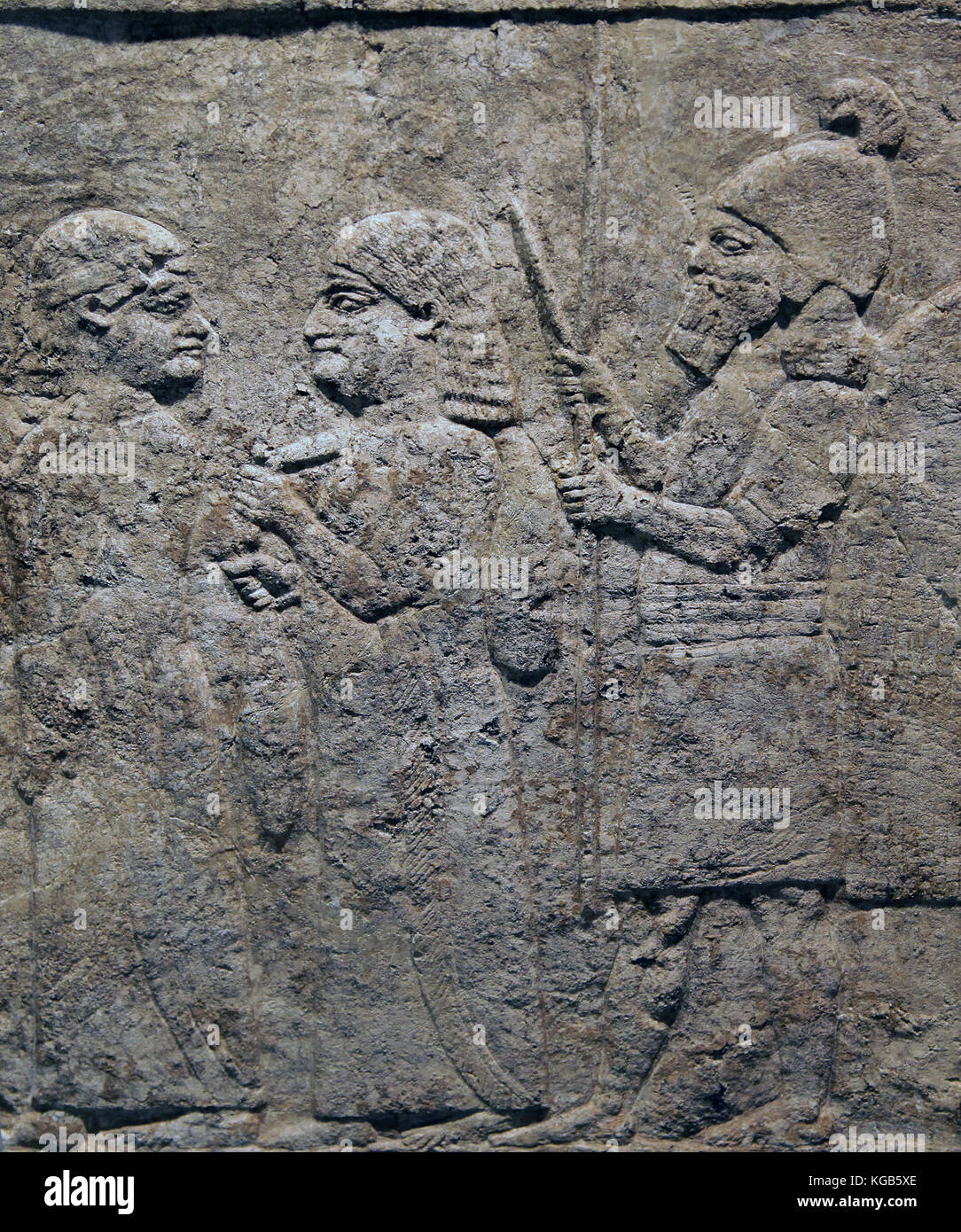 Nineveh.Limestone relief showing deportation scene 645 BC Stock Photo