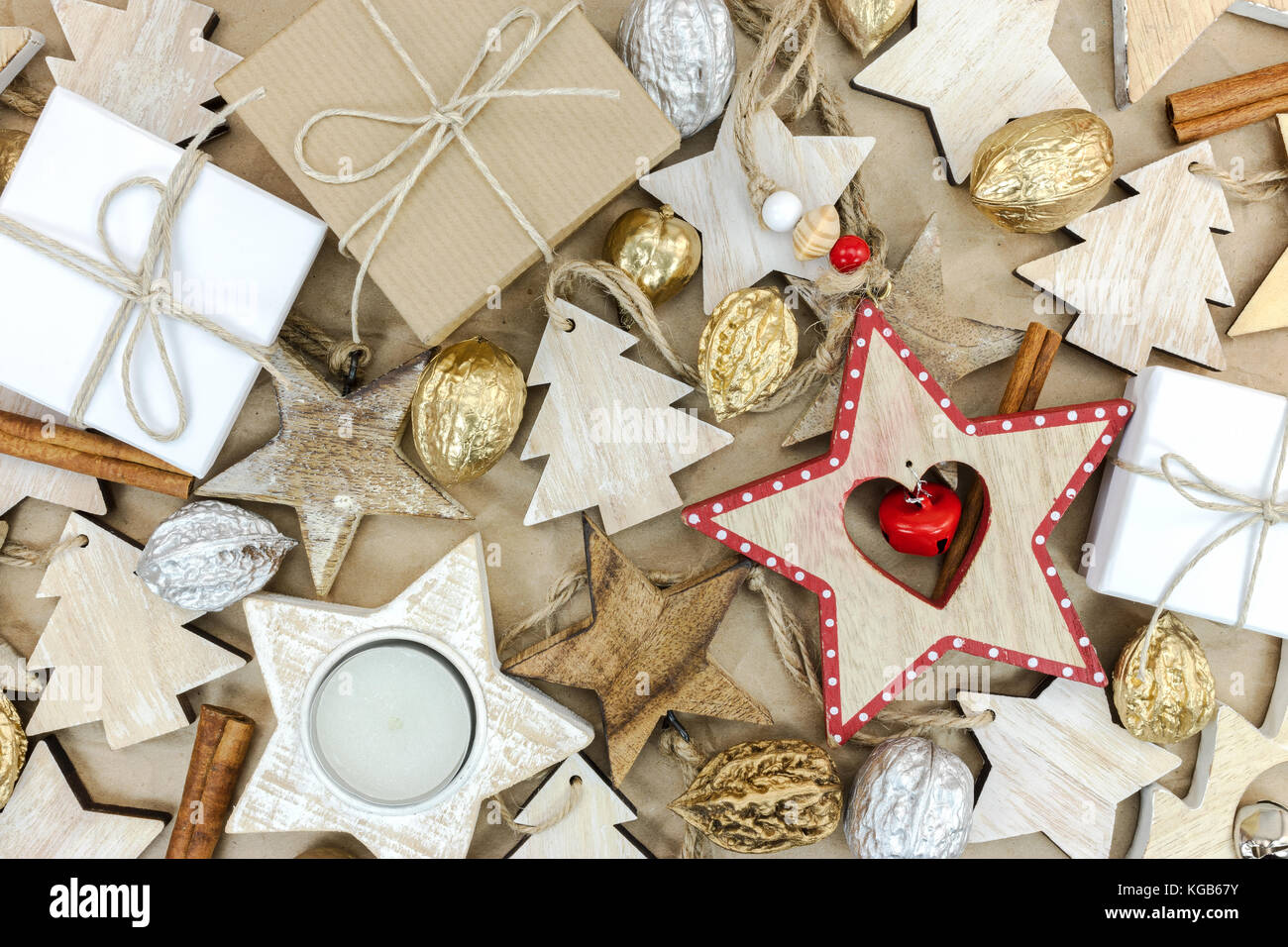 rustic wooden christmas tree decorations, gift boxes and nuts on