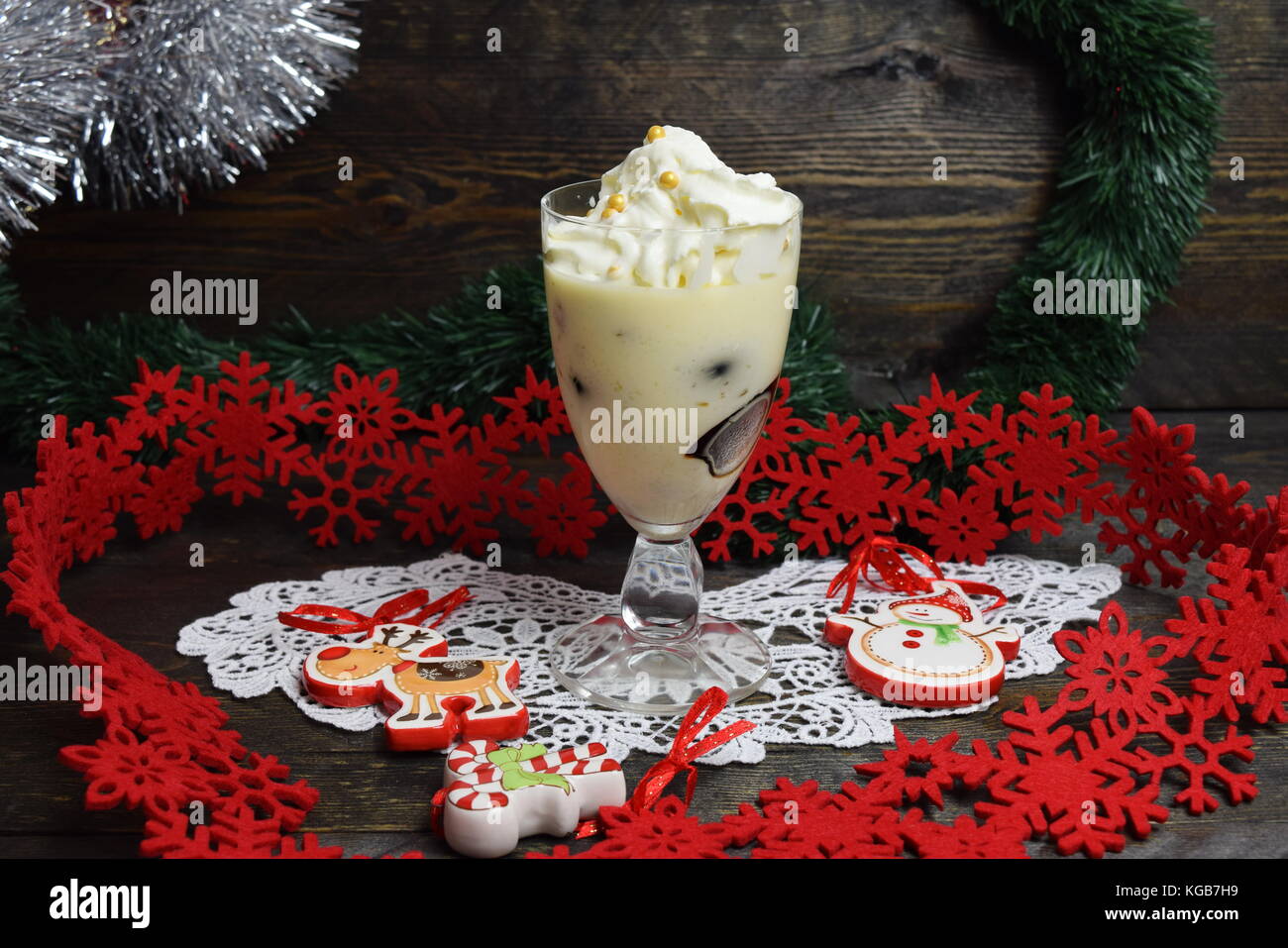 Dessert with Irish liqueur jelly cubes with whipped cream in a glass