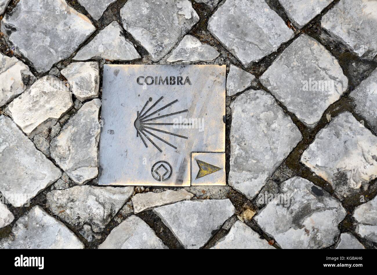 Plaque set in a cobbled street in Coimbra  showing the way path route to to The Camino Portuguese which spans from lLisbon to Sandiego Portugal Stock Photo