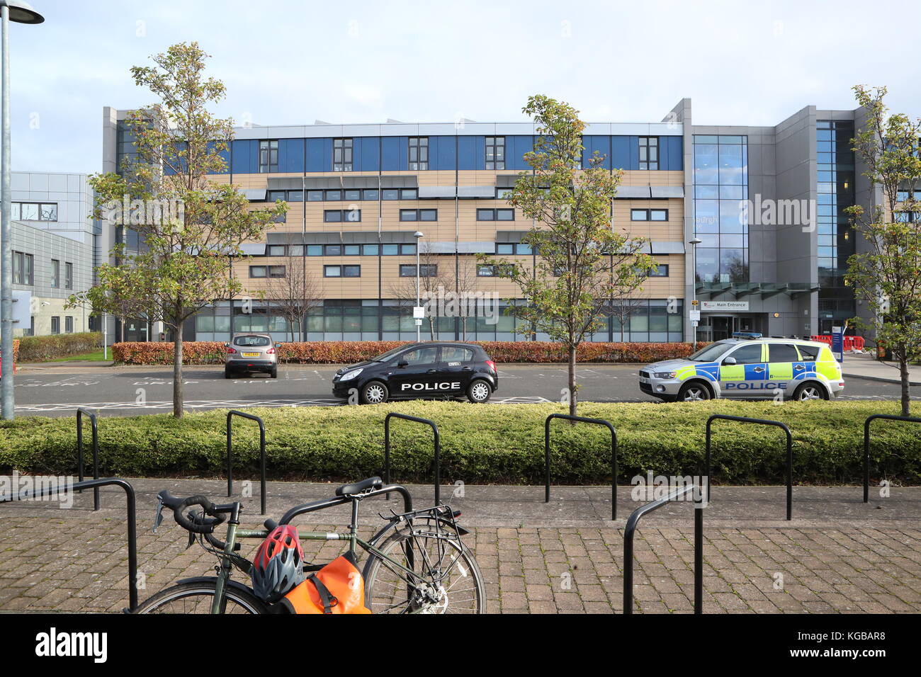 Police vehicles outside Edinburgh College's campus in Granton where a police officer suffered non life-threatening injuries after being stabbed in the back. Stock Photo