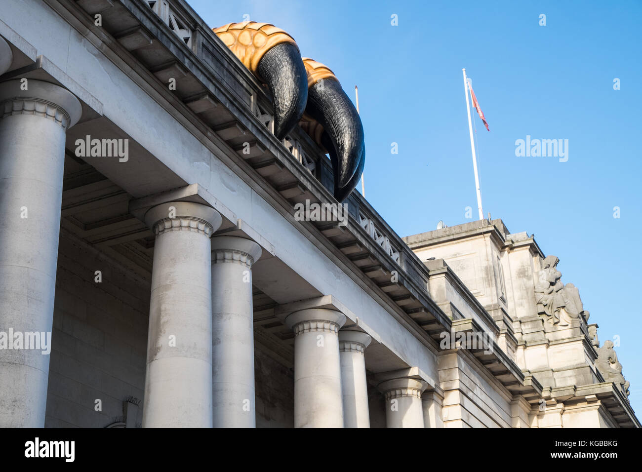 Huge,sculpture,dinosaur,claws,on,exterior,of,promoting,exhibition,National Museum Cardiff,Cathays Park,Cardiff,capital,of,Wales,Welsh,U.K.,UK,Europe, Stock Photo