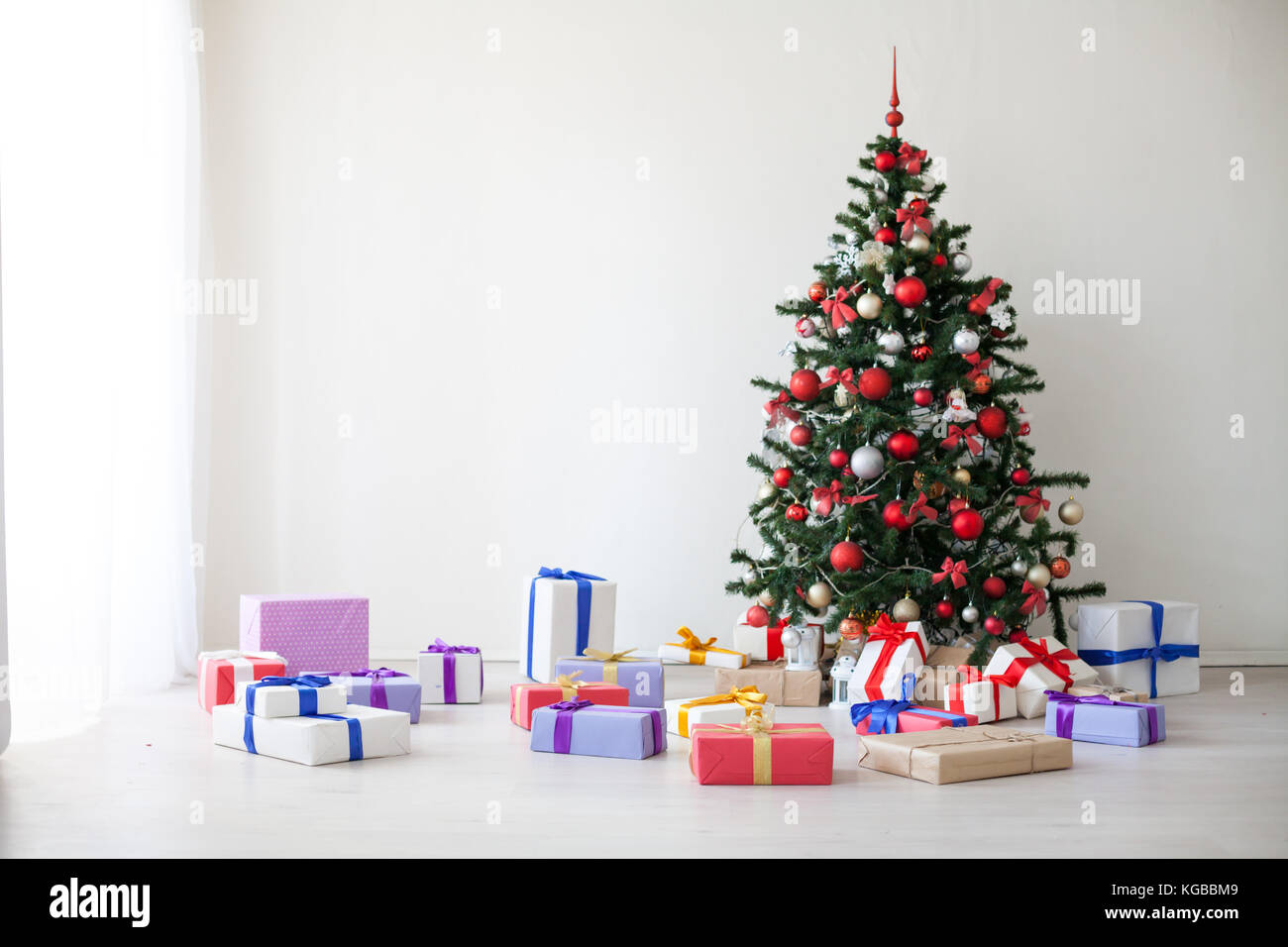 Christmas tree lots of gifts the new year decor Stock Photo Alamy