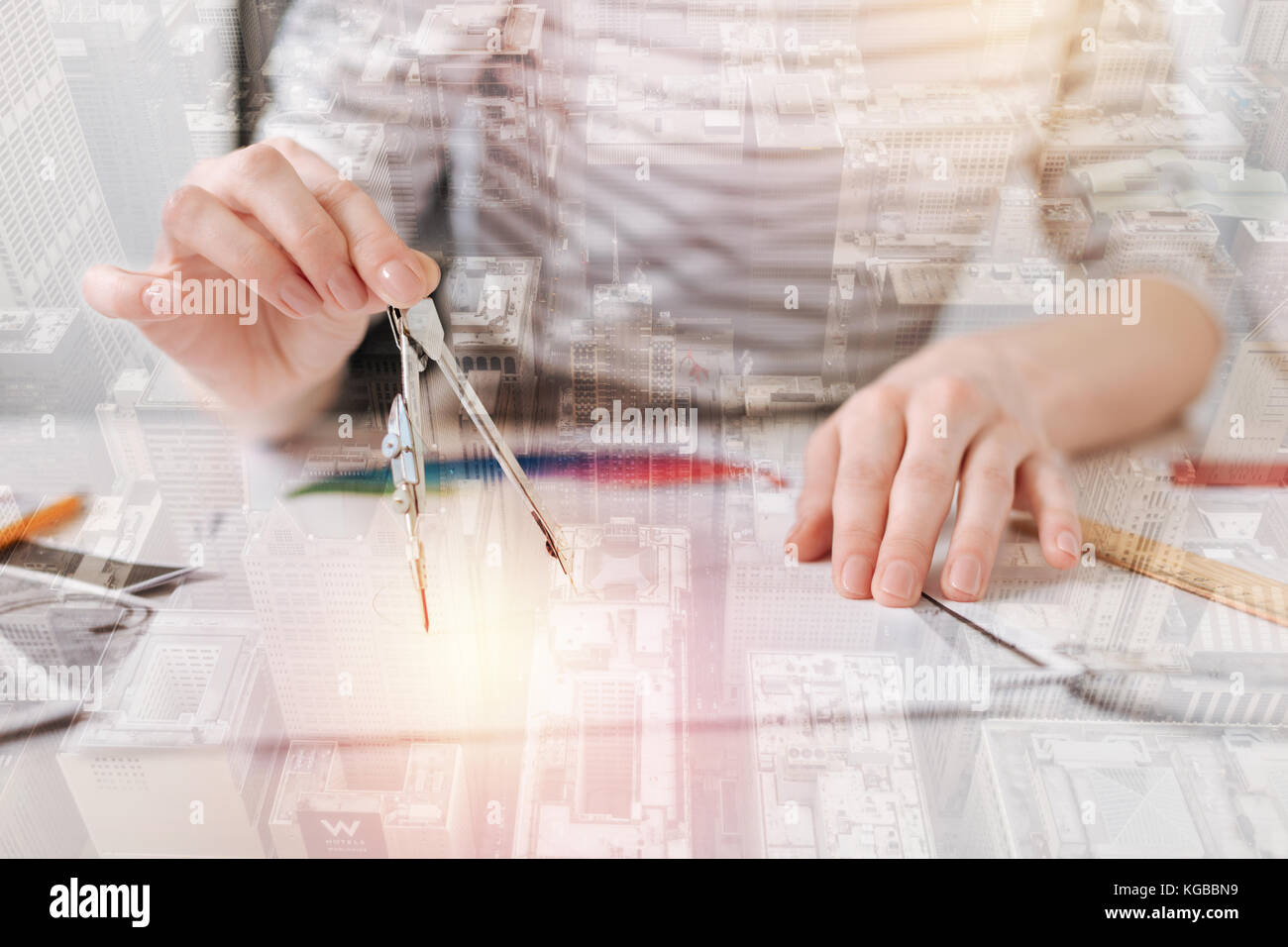 Professional female engineer using compasses Stock Photo - Alamy
