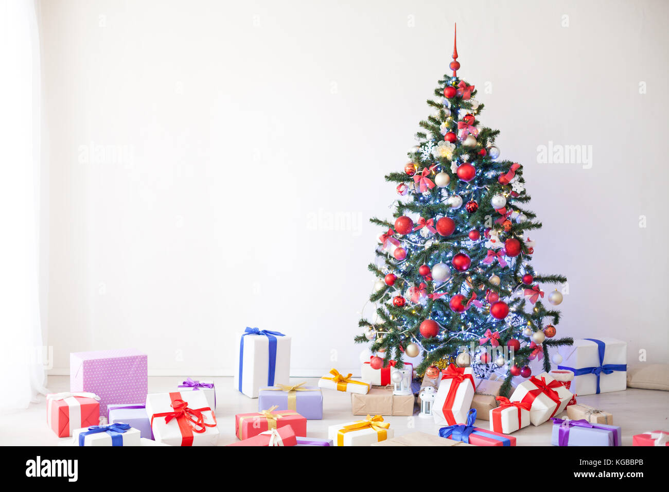 Christmas tree lots of gifts the new year decor Stock Photo Alamy