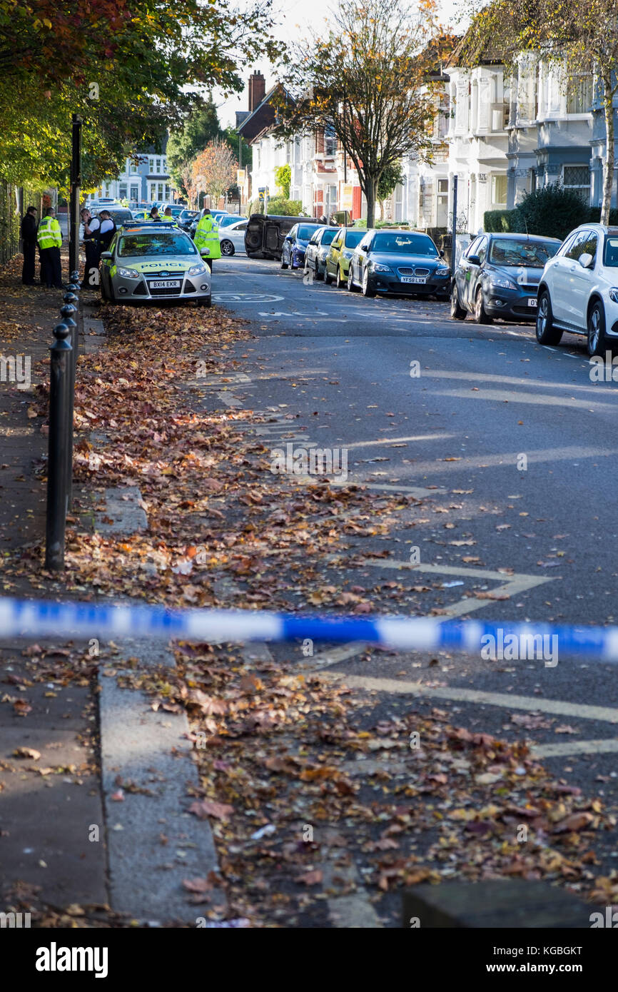 Harringay, North London, UK. 6th November 2017. Police close off Frobisher Road in the Harringay Ladder area of North London after a driver crashed into a parked car, causing it to flip. The incident occured opposite North Harringay Primary School. (c) Credit: Paul Swinney/Alamy Live News Stock Photo