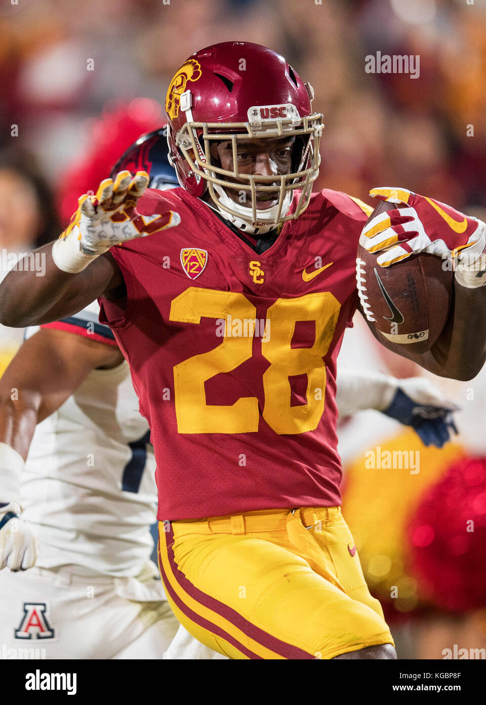 Los Angeles, CA, USA. 04th Nov, 2017. USC running back (28) Aca'Cedric Ware breaks a tackle and turns the corner, on his way to score a touchdown during a game between the Arizona Wildcats vs USC Trojans on Saturday, November 4, 2017 at the Los Angeles Memorial Coliseum in Los Angeles, California. USC defeated Arizona 49-35. (Mandatory Credit: Juan Lainez/MarinMedia.org/Cal Sport Media) (Complete photographer, and credit required) Credit: csm/Alamy Live News Stock Photo