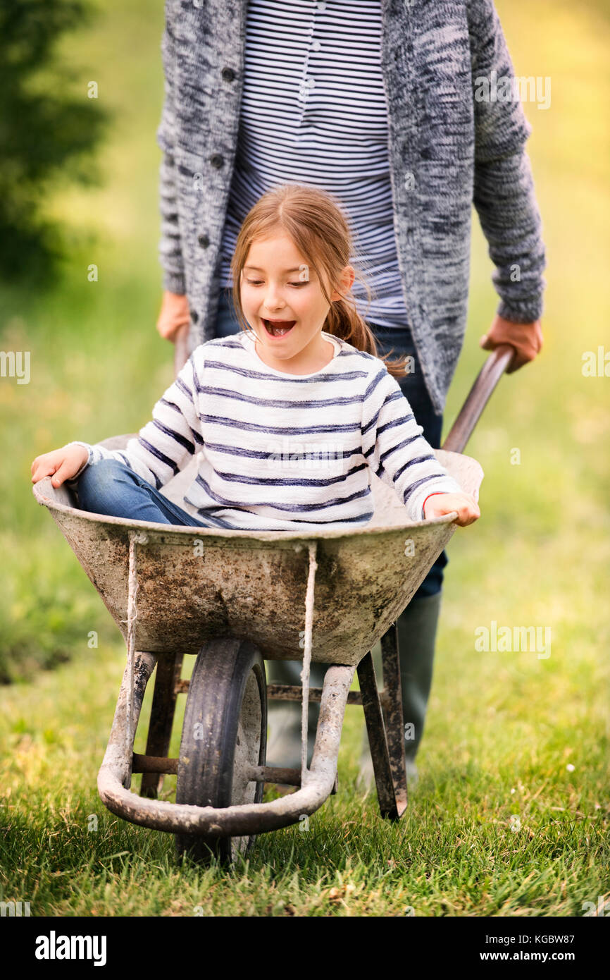 Old man pushing a wheelbarrow hires stock photography and images Alamy