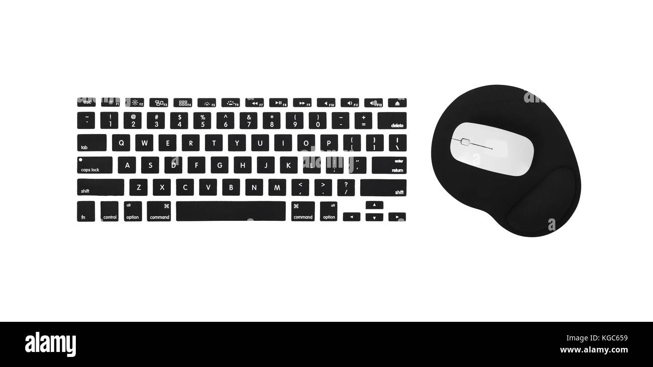 Computer keyboard, mouse and mousepad on a white background Stock Photo