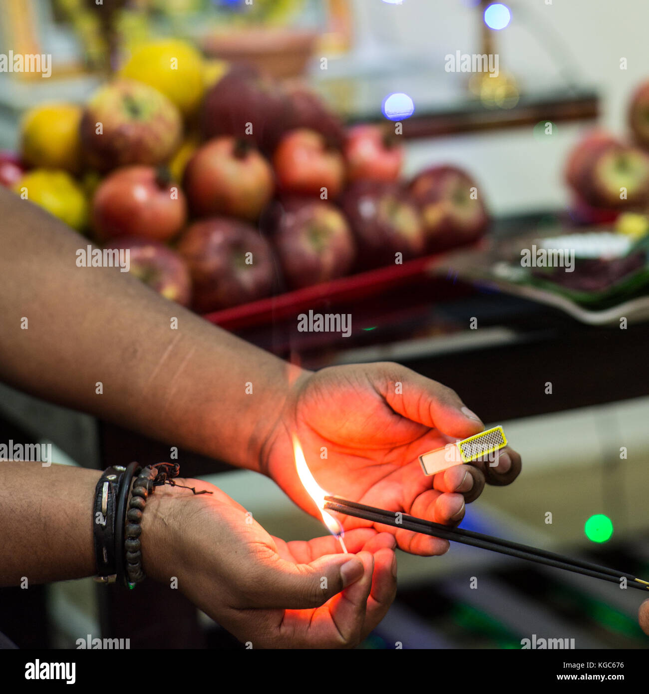lighting incense with a matchbox Stock Photo Alamy