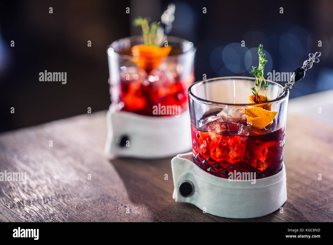 Fresh cocktail drink with ice fruit and herb decoration. Alcoholic, non-alcoholic drink-beverage at the bar counter in the pub restaurant  or night cl Stock Photo
