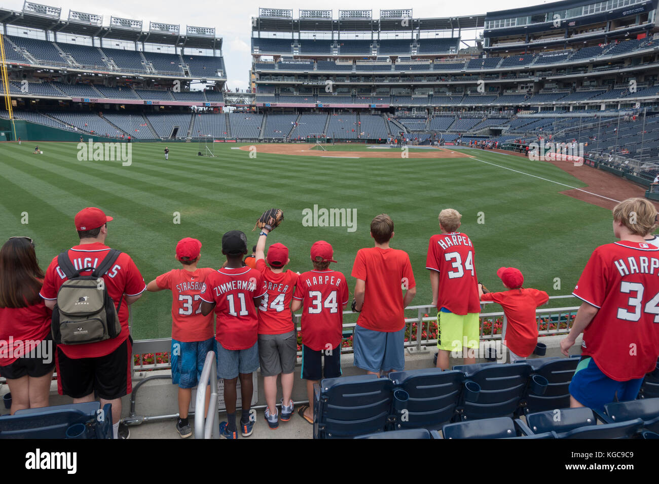 Kids waiting for foul balls during pre-game batting practice, Nationals Park, home of the Washington Nationals, Washington DC, United States. Stock Photo
