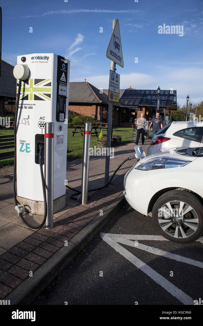 Nissan Leaf Electric Car at a recharging point at a Motorway Service Station. UK Stock Photo