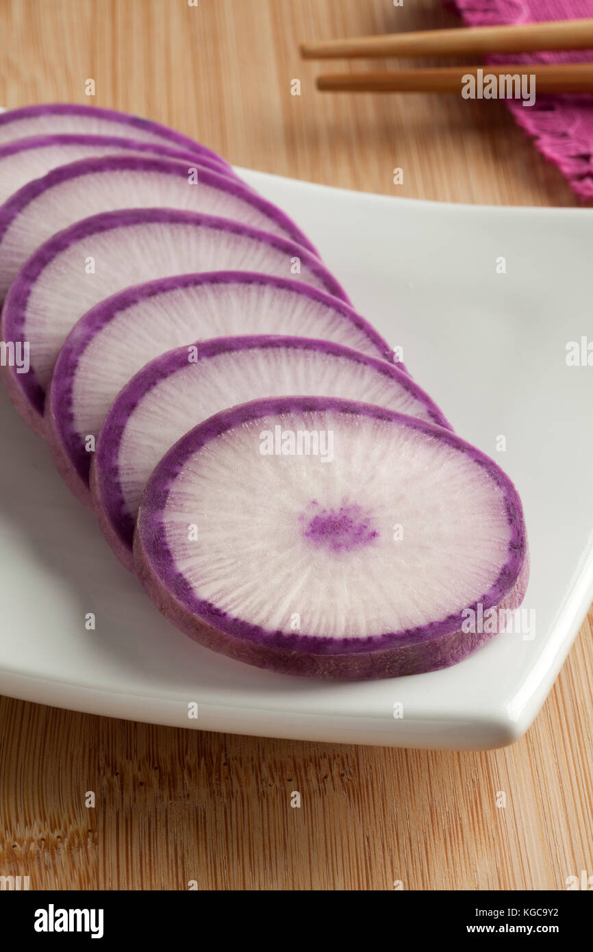 Fresh sliced purple Japanese daikon radish Stock Photo