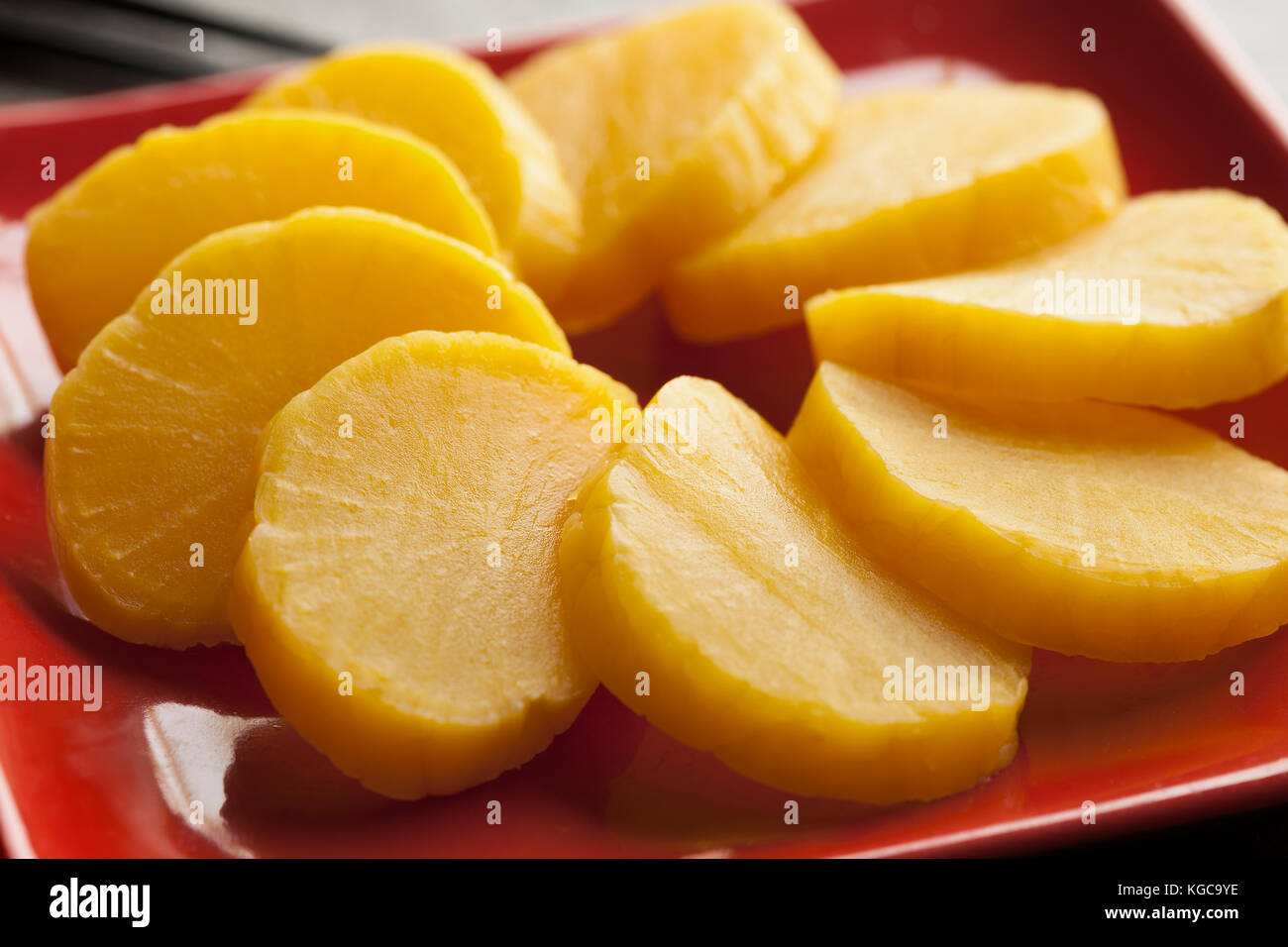 Traditional dish with sliced yellow Japanese pickled radish Stock Photo