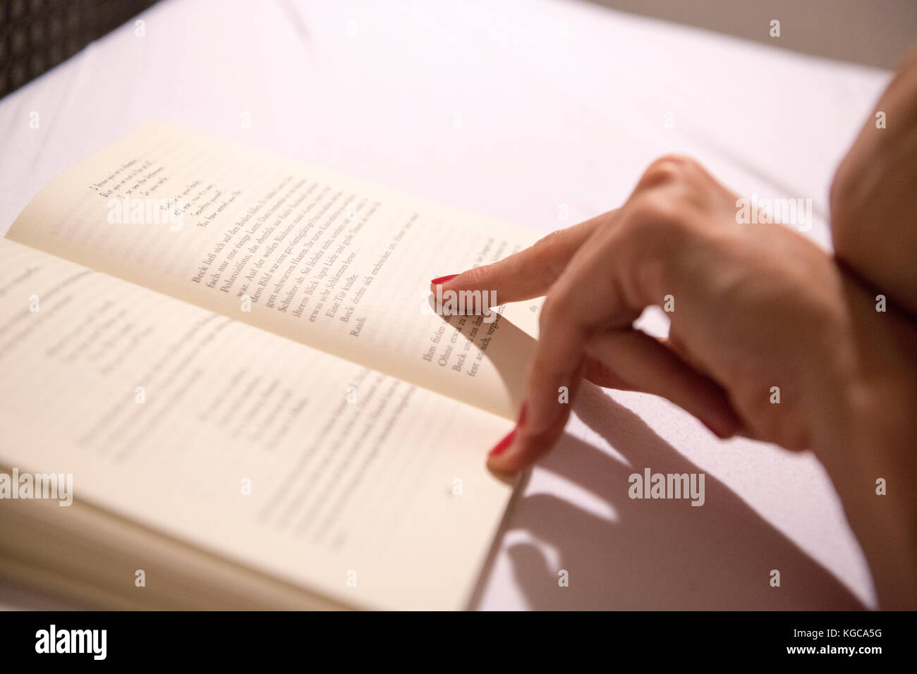 a woman reading a book Stock Photo