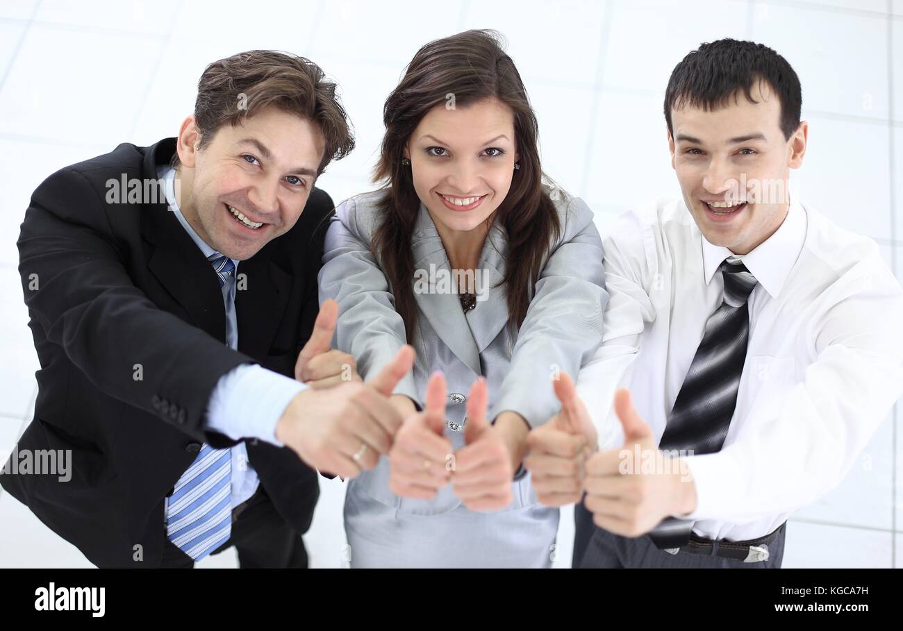 successful business team showing thumbs up Stock Photo - Alamy