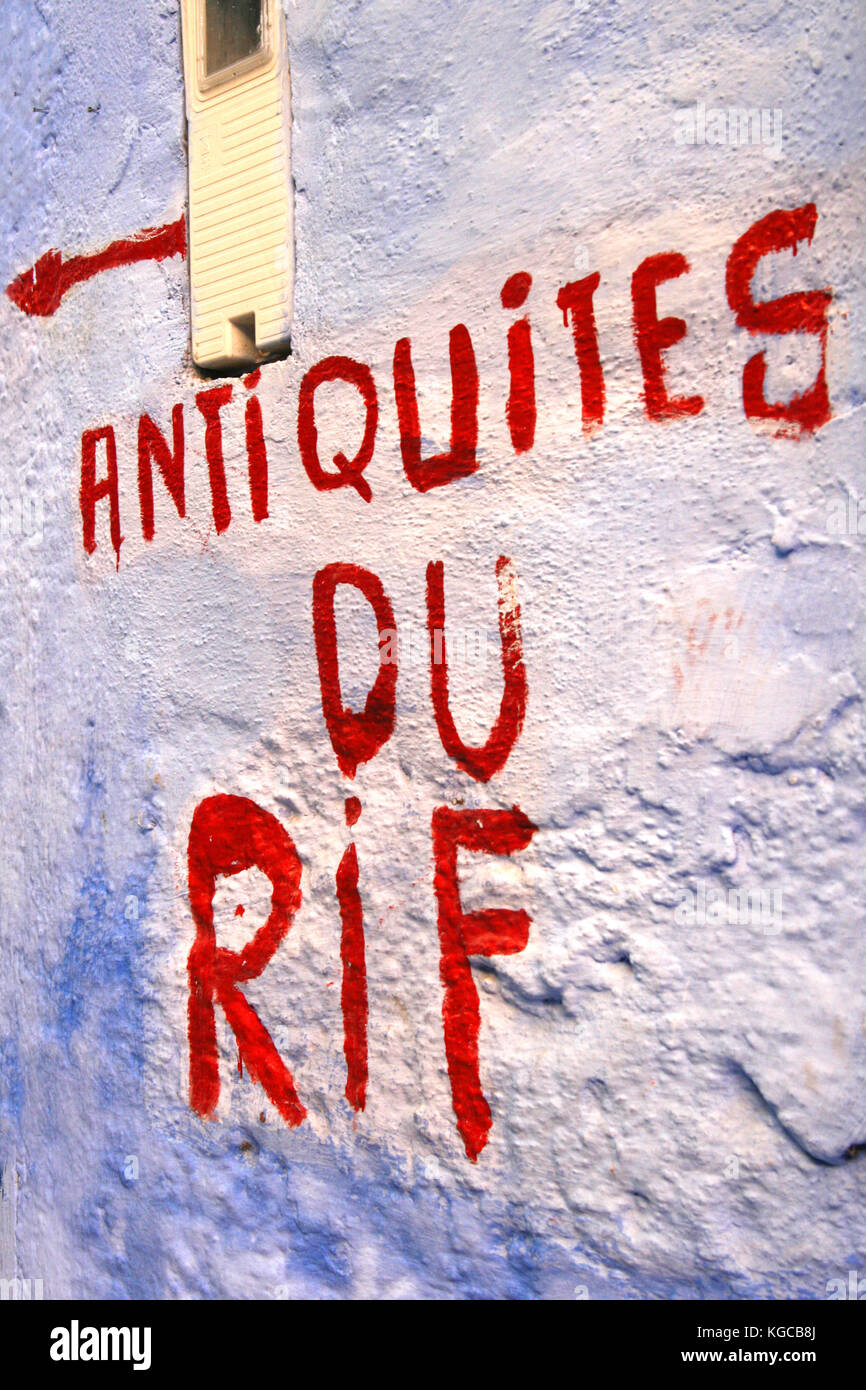 Rif antiquities, written on a blue wall of Chefchaouen. Morocco. Stock Photo