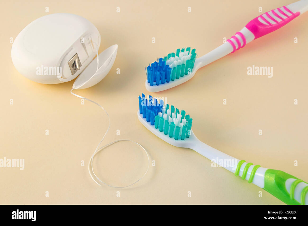Toothbrushes and dental floss on color background Stock Photo Alamy