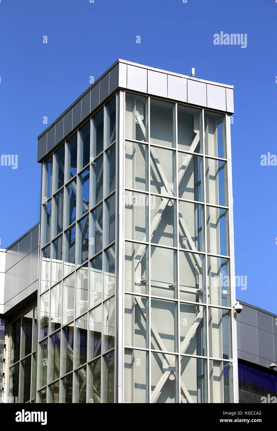 Elevator on outer side of the tech buildings of glass and concrete Stock Photo