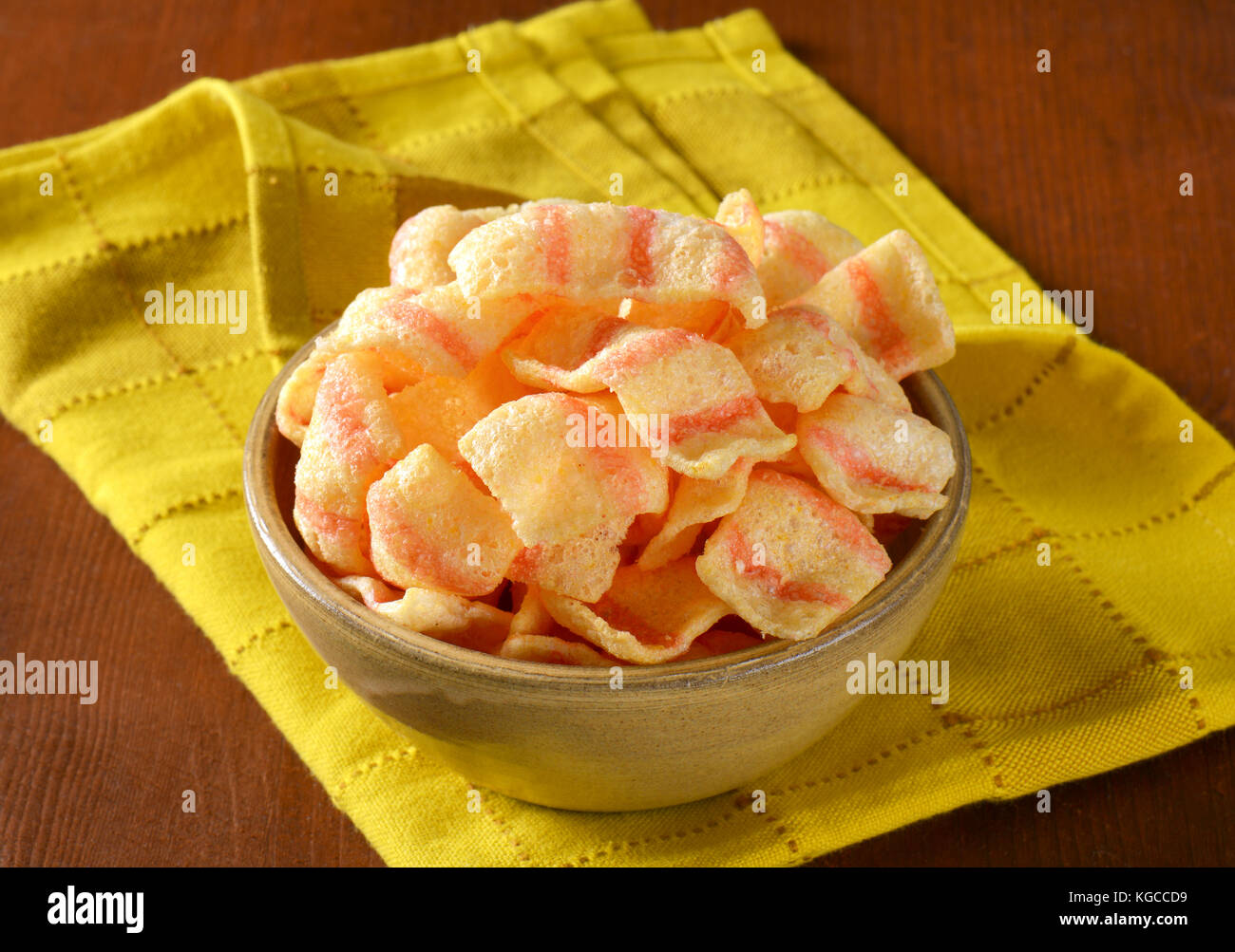 Bowl of bacon-flavored puffed wheat chips Stock Photo