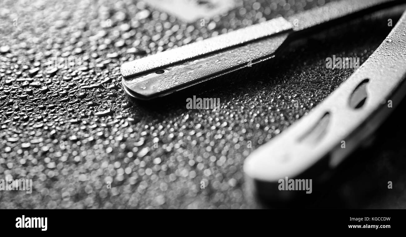 Unsafe Razorblade A dangerous razor and a metal blade on the table. Men's shaving Stock ...