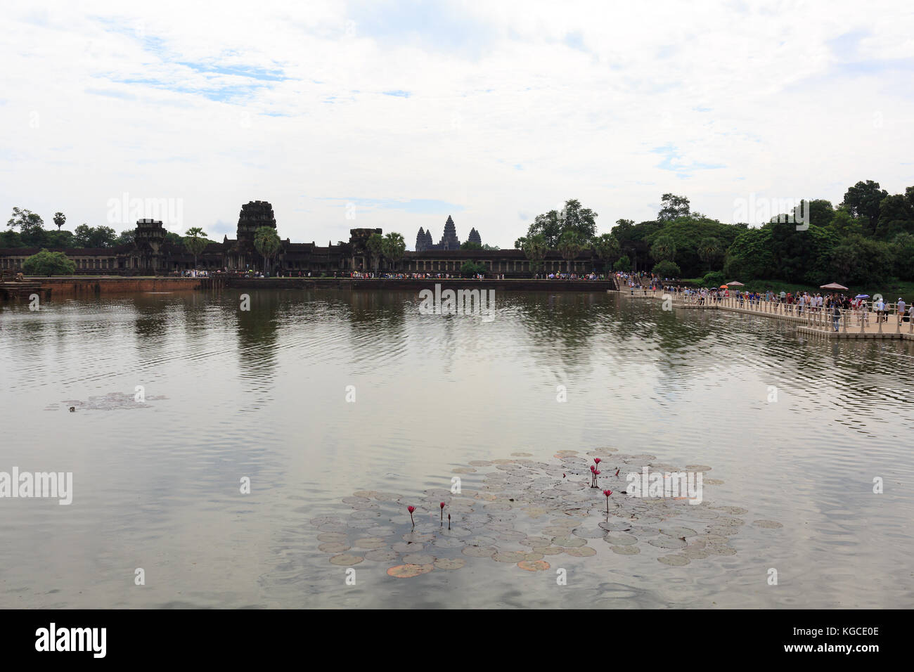 Tourists Visiting Angkor Wat Temple in Cambodia. Stock Photo