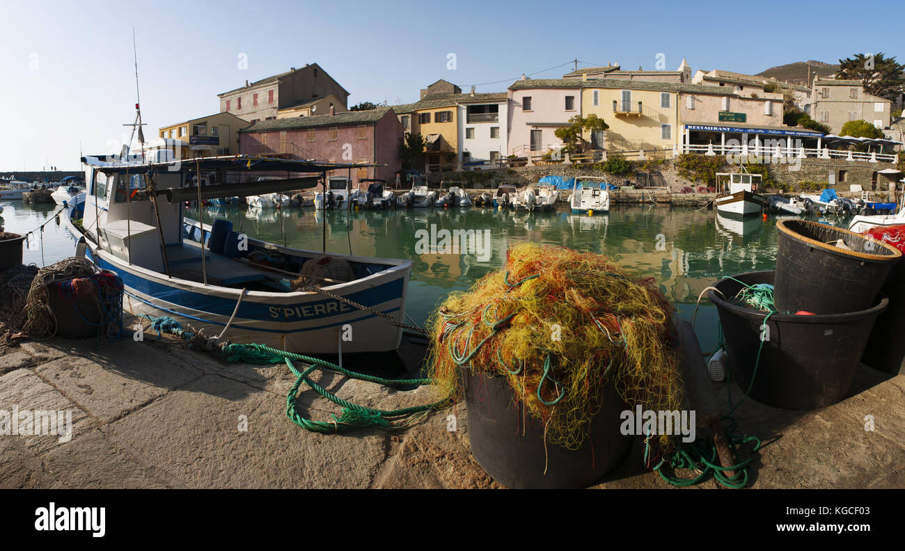 Corsica: fish nets and fishing boats in Centuri Port, the little harbour town on the Cap Corse peninsula, on the western side of Cap Corse Stock Photo