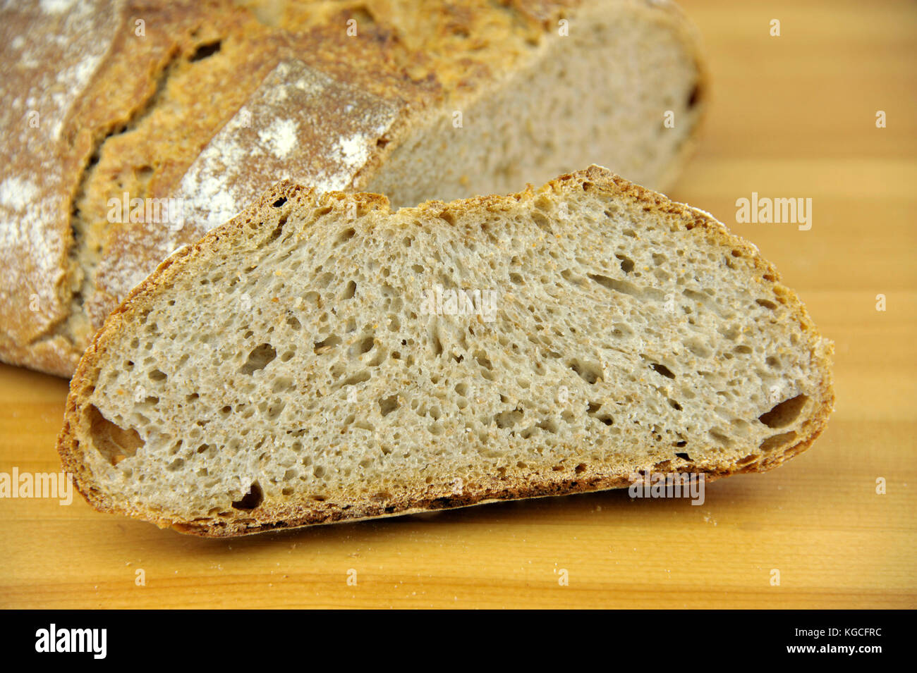 Crusty homemade artisan round wholemeal or whole wheat sourdough bread ...