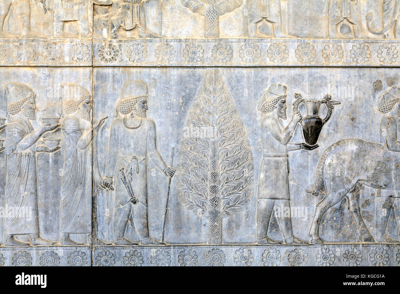 Ancient Persians carry presents to the emperor, basrelief on the wall