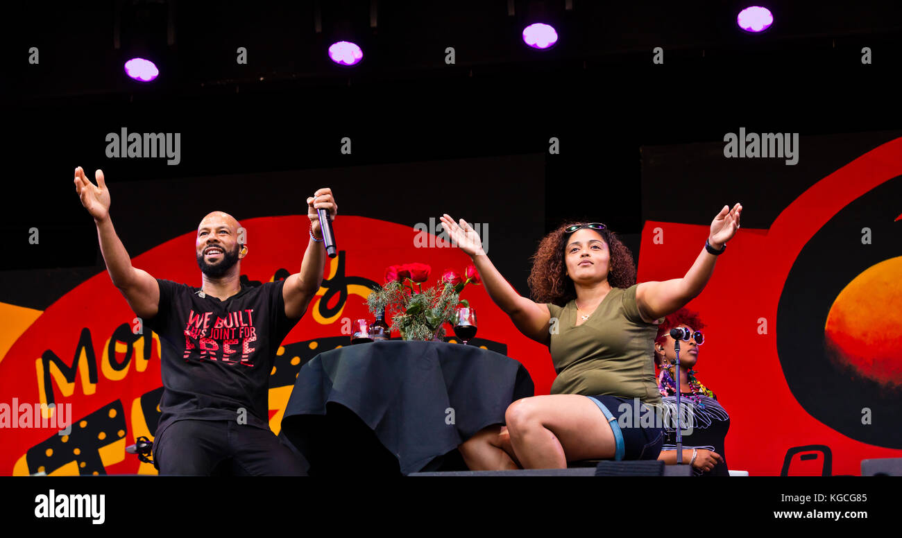 Hip hop artist COMMON honors women by singing to a fan brought up on stage - 60th MONTEREY JAZZ FESTIVAL, CALIFORNIA Stock Photo