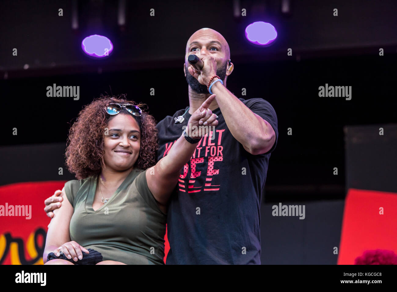 Hip hop artist COMMON honors women by singing to a fan brought up on stage - 60th MONTEREY JAZZ FESTIVAL, CALIFORNIA Stock Photo