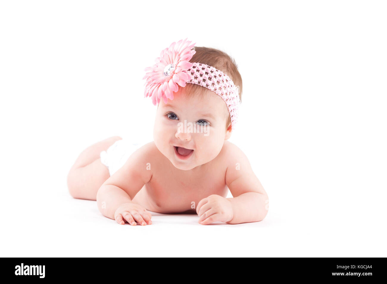 Beautiful Cute Baby Girl In Pink Flower Wrap Lies On Tummy Stock Photo Alamy