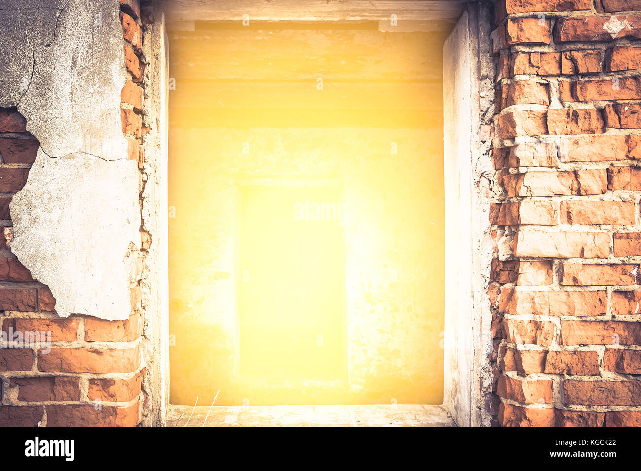 Cracked Brick Wall With Bright Yellow Light From Entrance With Effect Of Light At The End Of The Tunnel Stock Photo Alamy