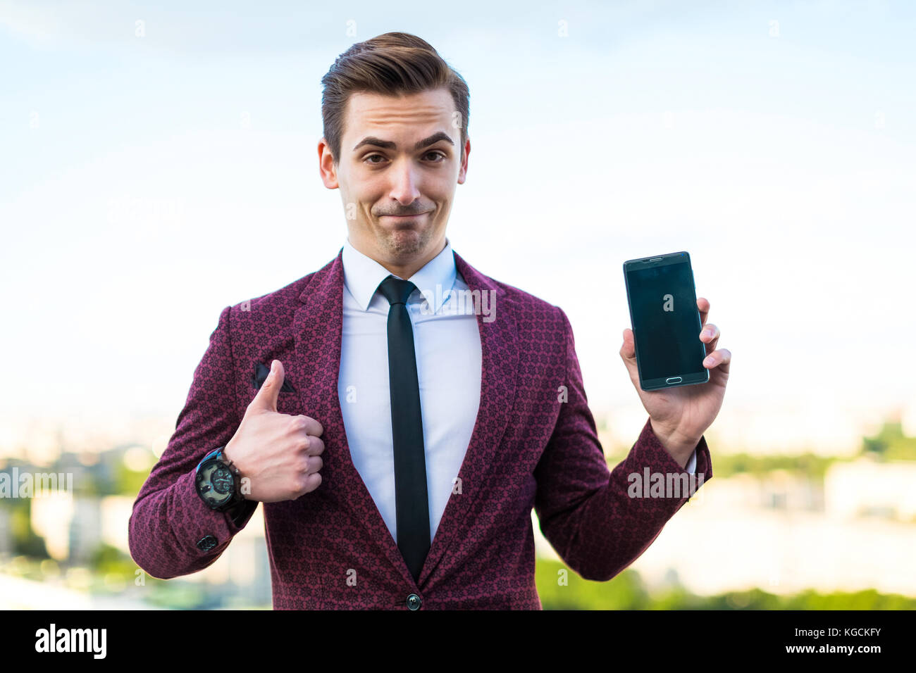 Young serious businessman in red suit and shirt with tie stand o Stock ...