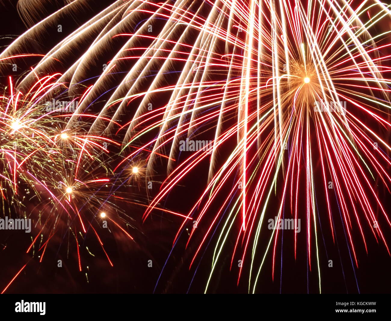 fireworks - a display of one big and a few small ones on black night sky Stock Photo