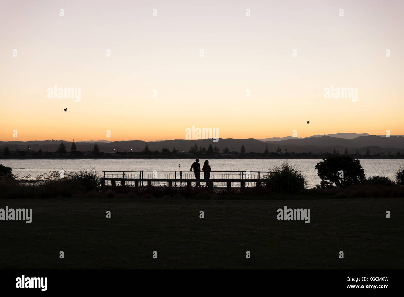 Romantic Sunset in the Evening by the Sea. Ahuiri, Napier, New Zealand Stock Photo