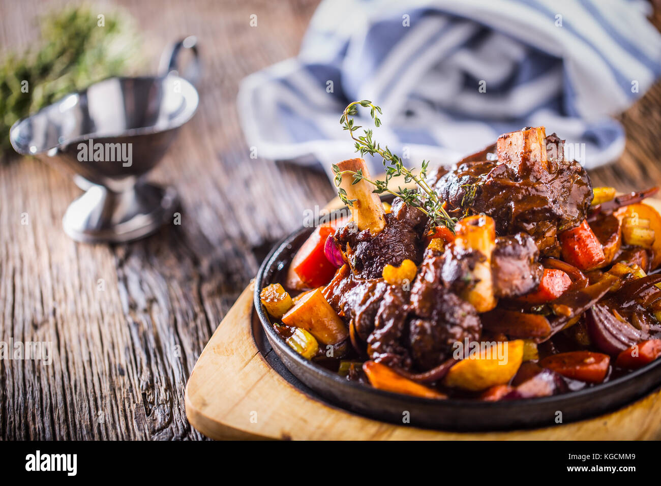 Lamb shank.Confit lamb shank with potatoes vegetable and draft beer in pub hotel or restaurant. Stock Photo