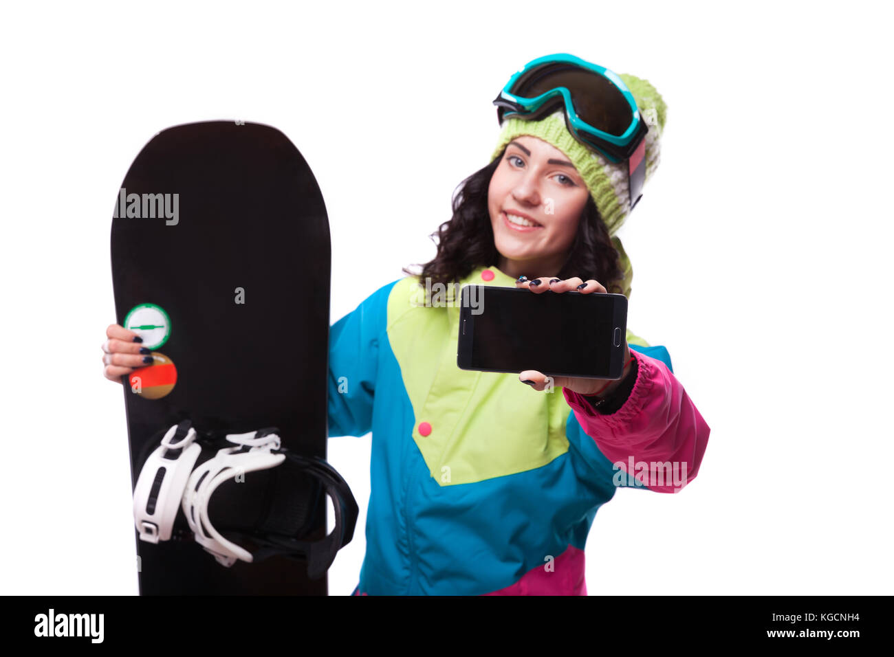 beautiful young woman in ski outfit and hold snowboard Stock Photo