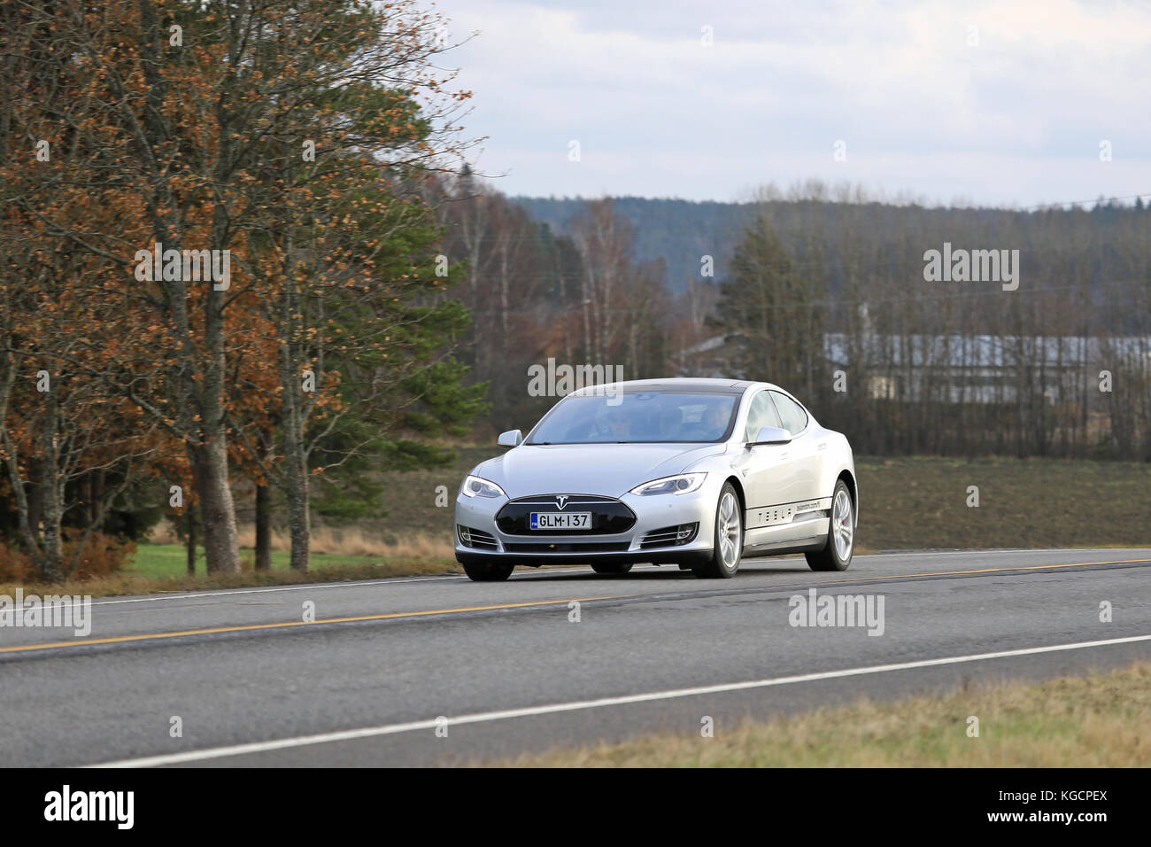 SALO, FINLAND - OCTOBER 31, 2015: Silver Tesla Model S electric car on the road in South of Finland. Tesla will build next generation maps through its Stock Photo