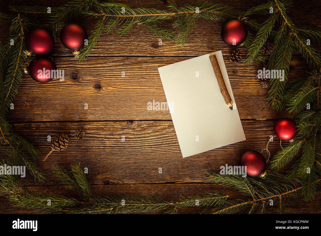 Christmas wooden background with letter to Santa. Greeting letter with