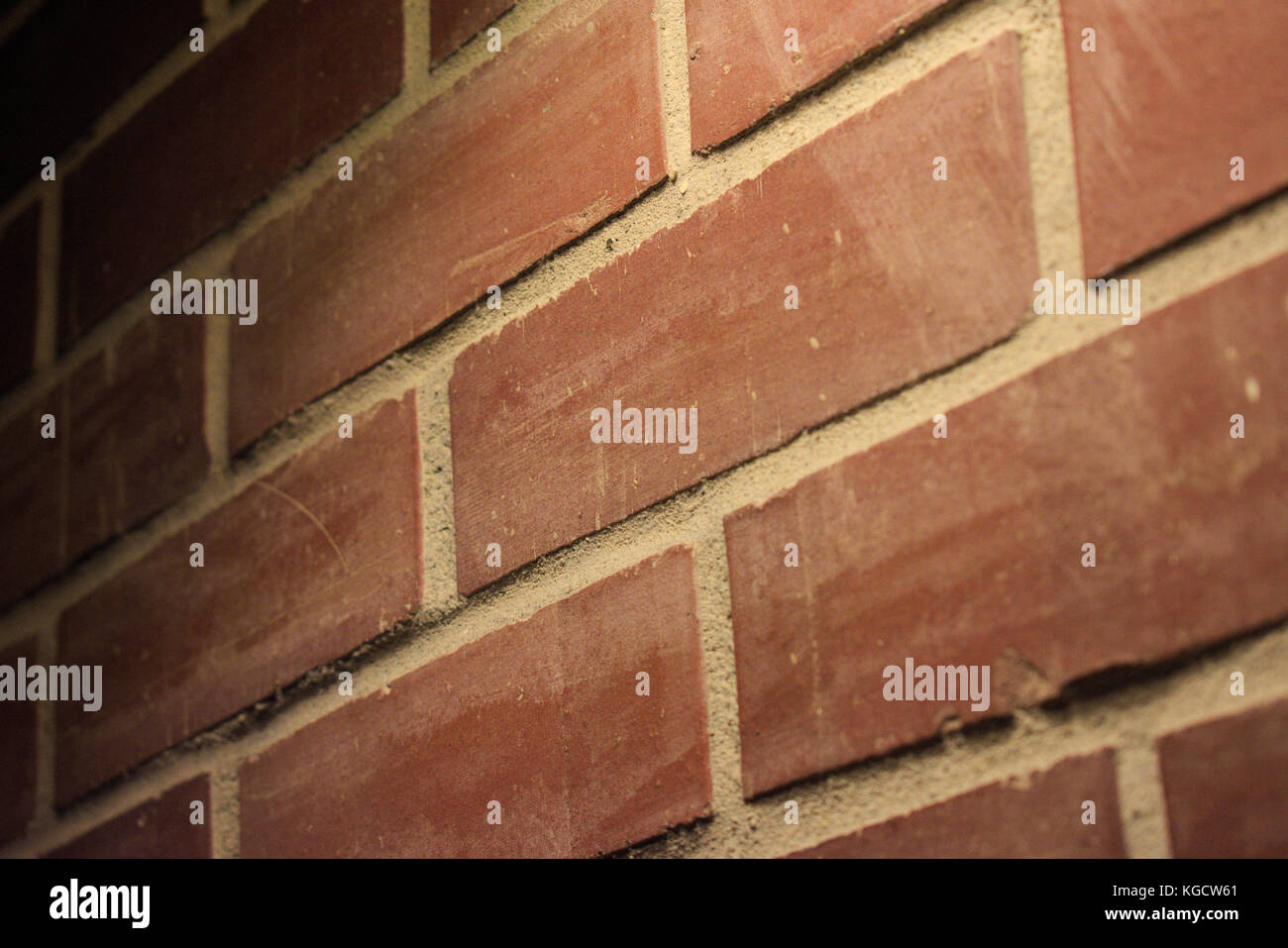 Dimly Lit Brick Wall Stock Photo