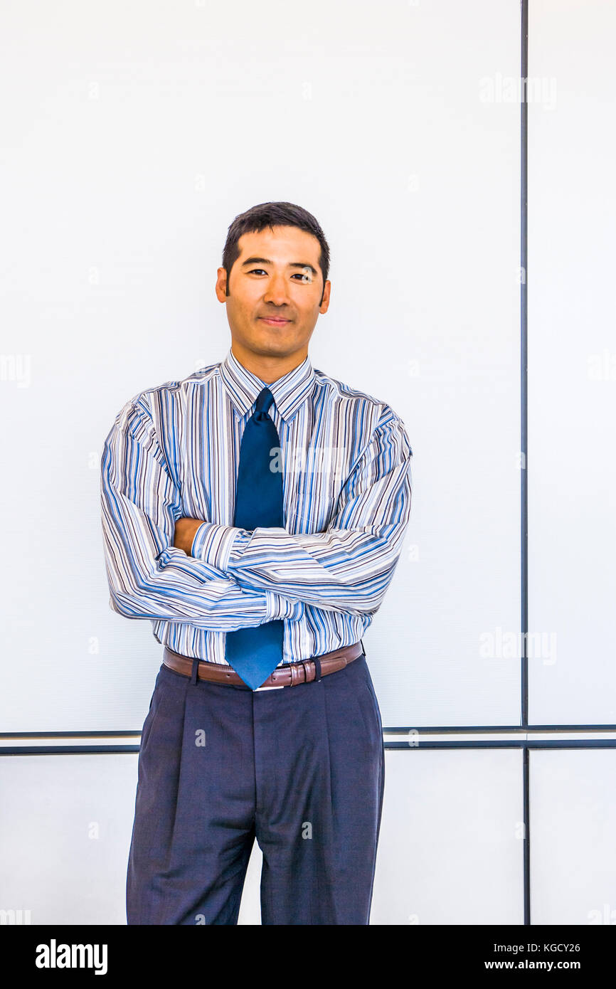 Portraits of a Asian businessman with his arms crossed Stock Photo - Alamy