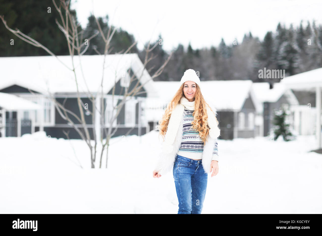 Young pretty smiling girl outdoors at winter snowy street Stock Photo ...