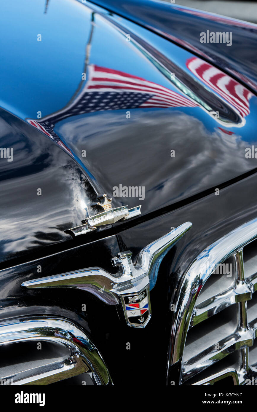1960 Cadillac Eldorado Convertible car with an american flag reflected in the bonnet. UK Stock Photo